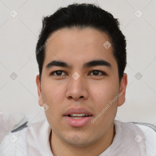 Joyful latino young-adult male with short  black hair and brown eyes