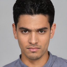 Neutral white young-adult male with short  black hair and brown eyes