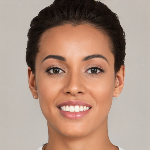 Joyful white young-adult female with short  brown hair and brown eyes