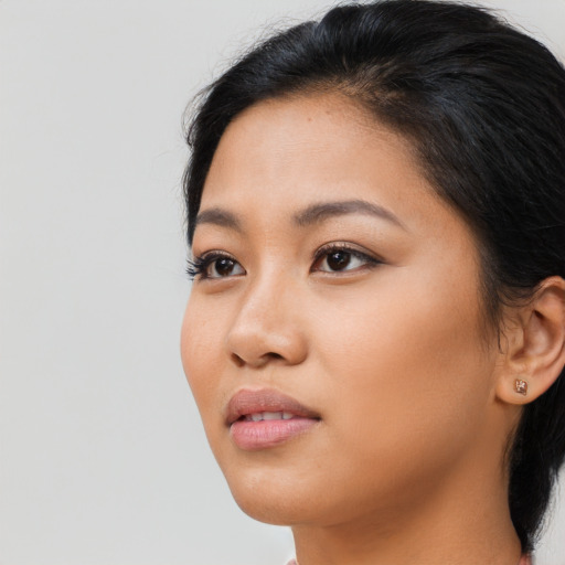 Neutral latino young-adult female with long  brown hair and brown eyes