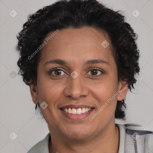 Joyful latino adult female with short  brown hair and brown eyes