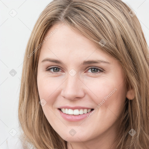 Joyful white young-adult female with long  brown hair and grey eyes