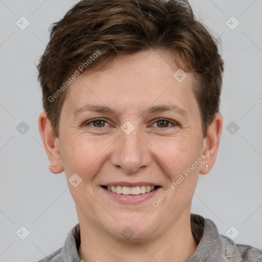 Joyful white adult male with short  brown hair and grey eyes