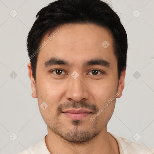 Joyful white young-adult male with short  black hair and brown eyes