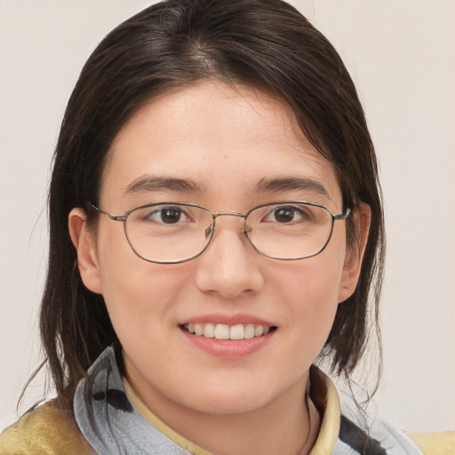 Joyful white young-adult female with medium  brown hair and brown eyes