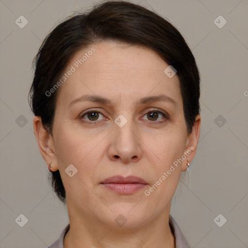 Joyful white adult female with short  brown hair and brown eyes