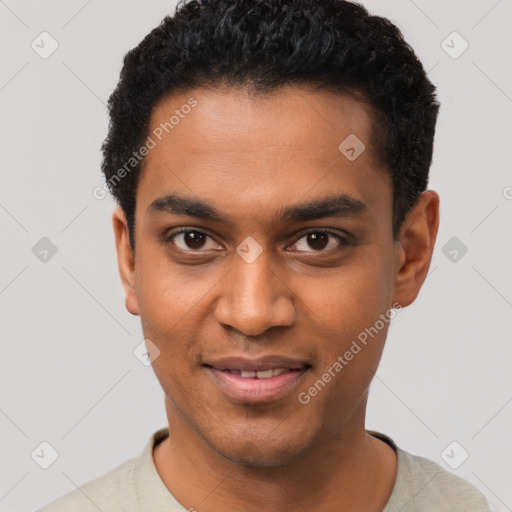 Joyful black young-adult male with short  black hair and brown eyes