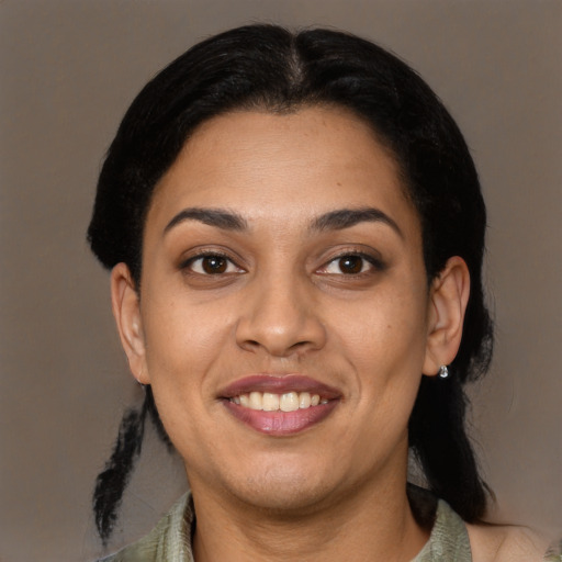 Joyful latino young-adult female with medium  black hair and brown eyes