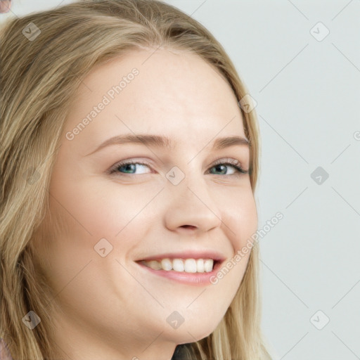 Joyful white young-adult female with long  brown hair and blue eyes