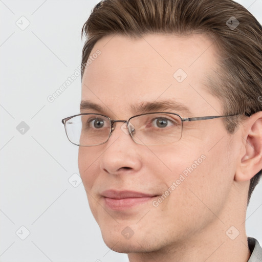 Joyful white adult male with short  brown hair and grey eyes