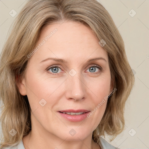 Joyful white adult female with medium  brown hair and blue eyes