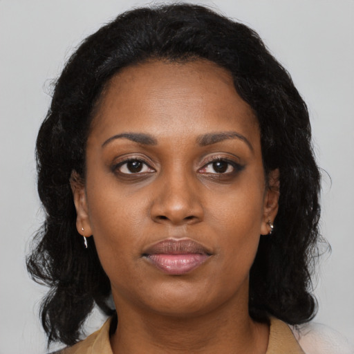 Neutral black adult female with medium  black hair and brown eyes