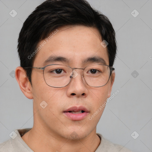 Neutral asian young-adult male with short  brown hair and brown eyes