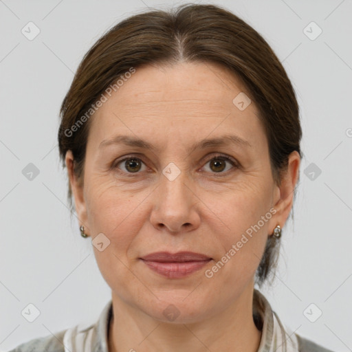 Joyful white adult female with medium  brown hair and grey eyes