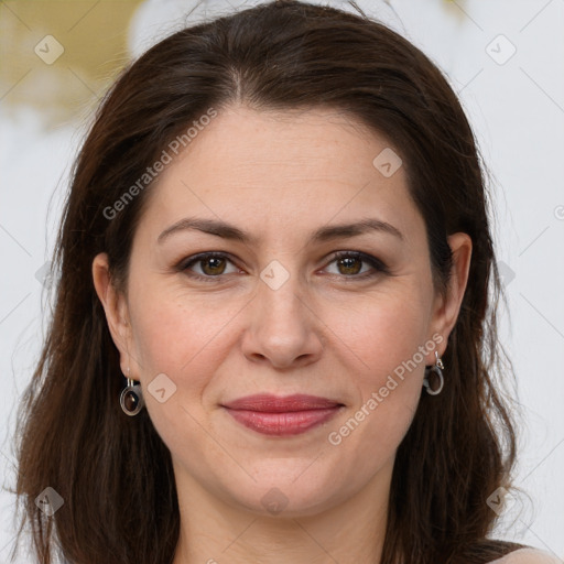 Joyful white adult female with long  brown hair and grey eyes