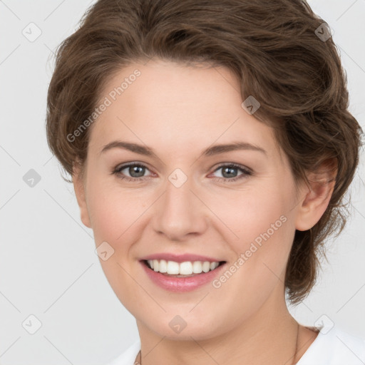 Joyful white young-adult female with medium  brown hair and green eyes