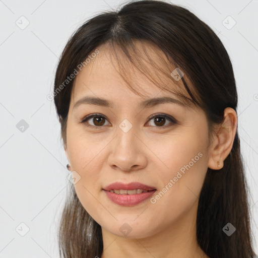 Joyful white young-adult female with long  brown hair and brown eyes