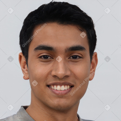 Joyful latino young-adult male with short  black hair and brown eyes