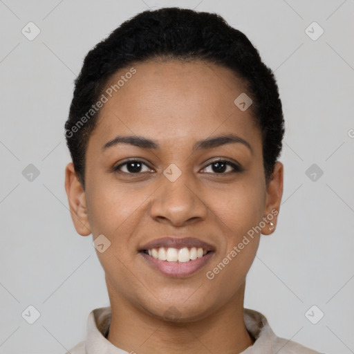 Joyful latino young-adult female with short  black hair and brown eyes