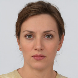 Neutral white young-adult female with short  brown hair and brown eyes