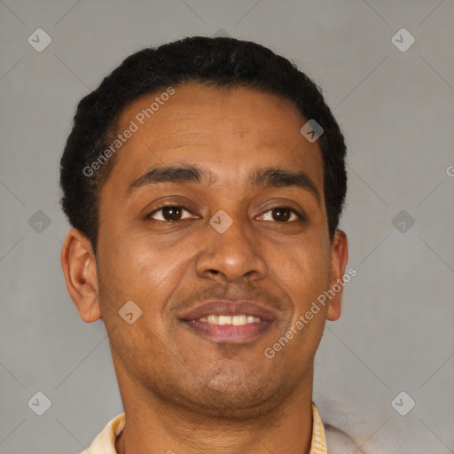 Joyful latino young-adult male with short  brown hair and brown eyes