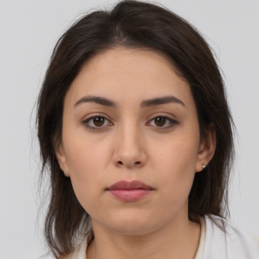 Neutral white young-adult female with medium  brown hair and brown eyes