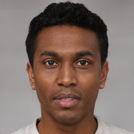Neutral black young-adult male with short  black hair and brown eyes