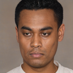 Neutral latino young-adult male with short  black hair and brown eyes