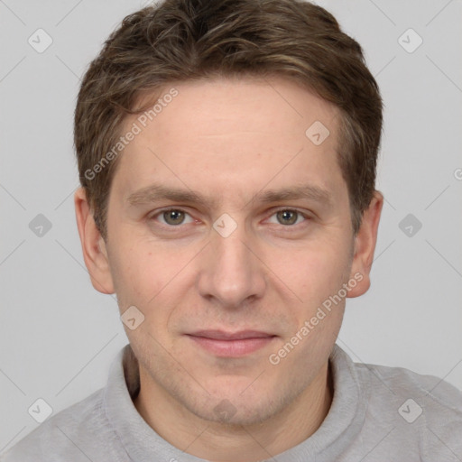 Joyful white adult male with short  brown hair and grey eyes