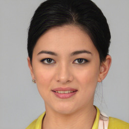 Joyful asian young-adult female with short  black hair and brown eyes