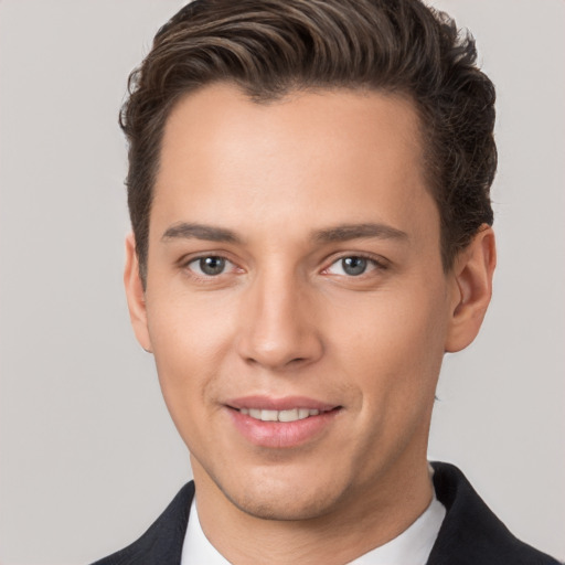 Joyful white young-adult male with short  brown hair and brown eyes