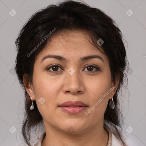 Joyful white adult female with medium  brown hair and brown eyes