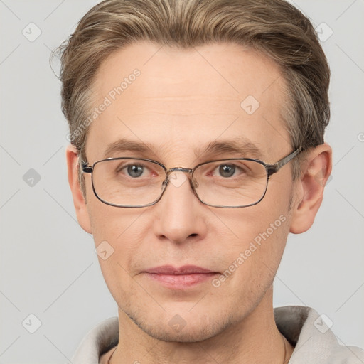 Joyful white adult male with short  brown hair and grey eyes