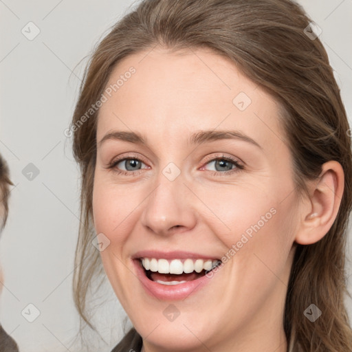 Joyful white young-adult female with medium  brown hair and grey eyes