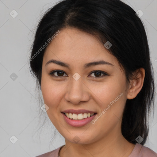 Joyful latino young-adult female with medium  brown hair and brown eyes