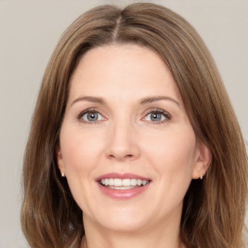 Joyful white young-adult female with medium  brown hair and green eyes