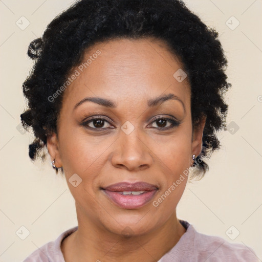 Joyful black adult female with short  brown hair and brown eyes