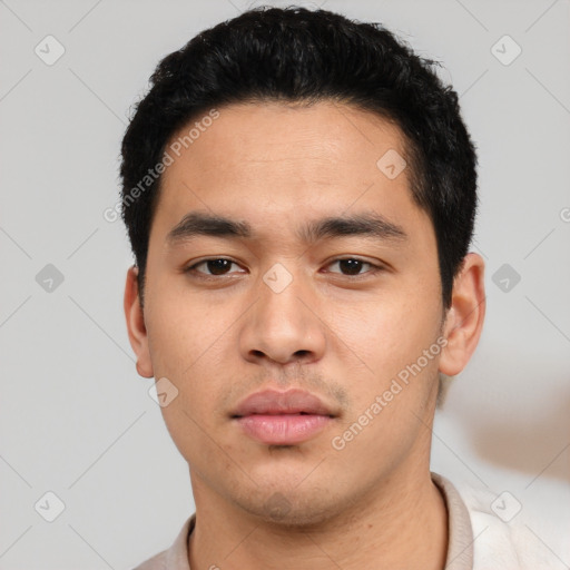 Neutral white young-adult male with short  black hair and brown eyes
