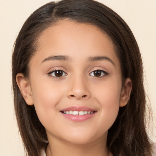 Joyful white child female with long  brown hair and brown eyes