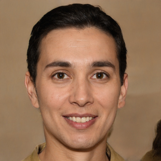 Joyful white adult male with short  brown hair and brown eyes