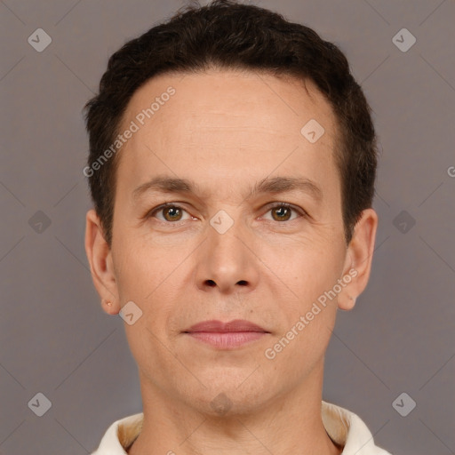 Joyful white adult male with short  brown hair and brown eyes