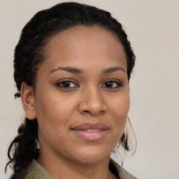 Joyful black young-adult female with medium  brown hair and brown eyes