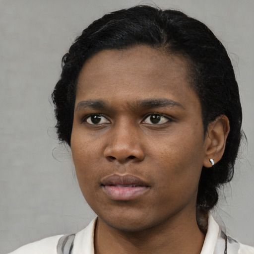 Neutral black young-adult female with short  black hair and brown eyes