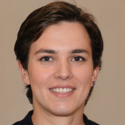 Joyful white young-adult female with medium  brown hair and brown eyes