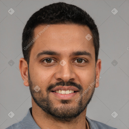 Joyful latino young-adult male with short  black hair and brown eyes