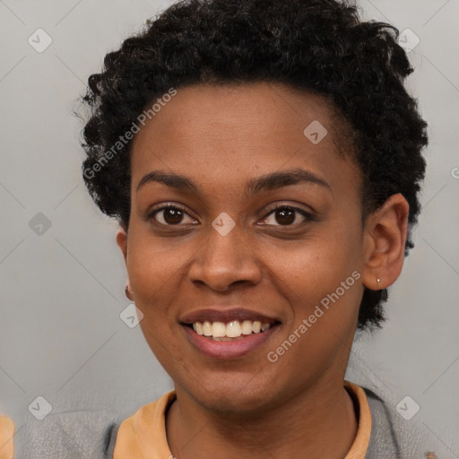 Joyful black young-adult female with short  brown hair and brown eyes