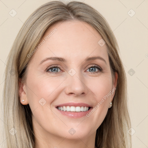 Joyful white young-adult female with long  brown hair and blue eyes