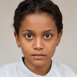 Joyful white child female with short  brown hair and brown eyes