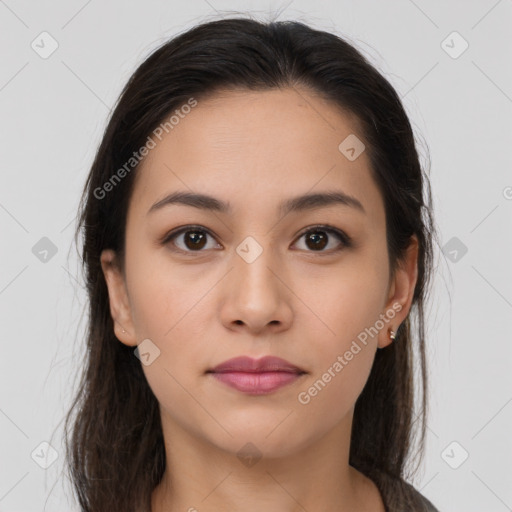 Joyful latino young-adult female with long  brown hair and brown eyes