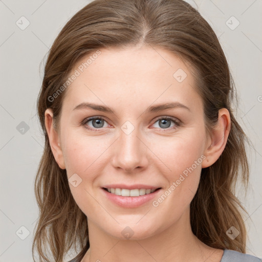 Joyful white young-adult female with long  brown hair and blue eyes